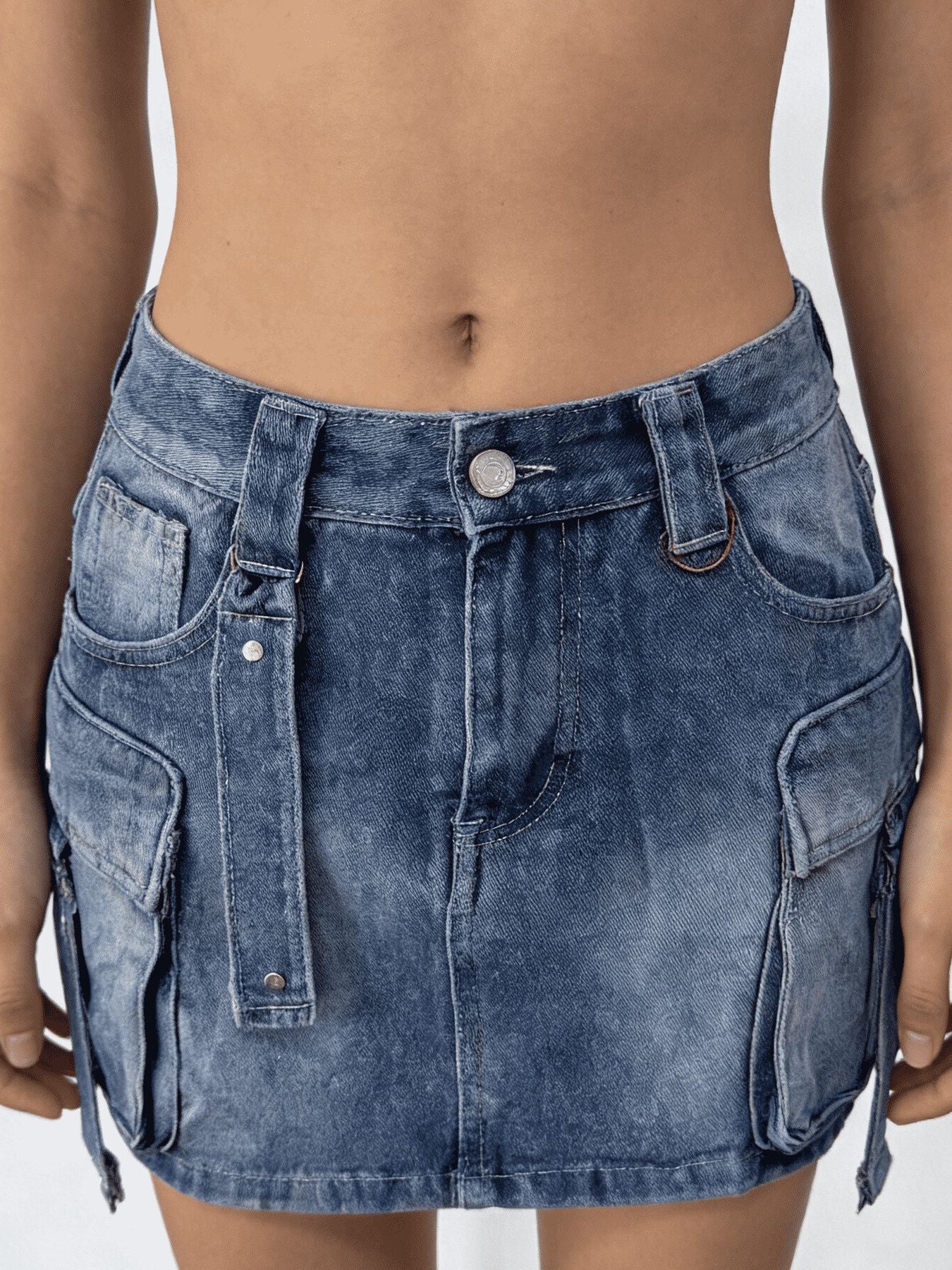 Blue denim skirt worn by a person on a plain background