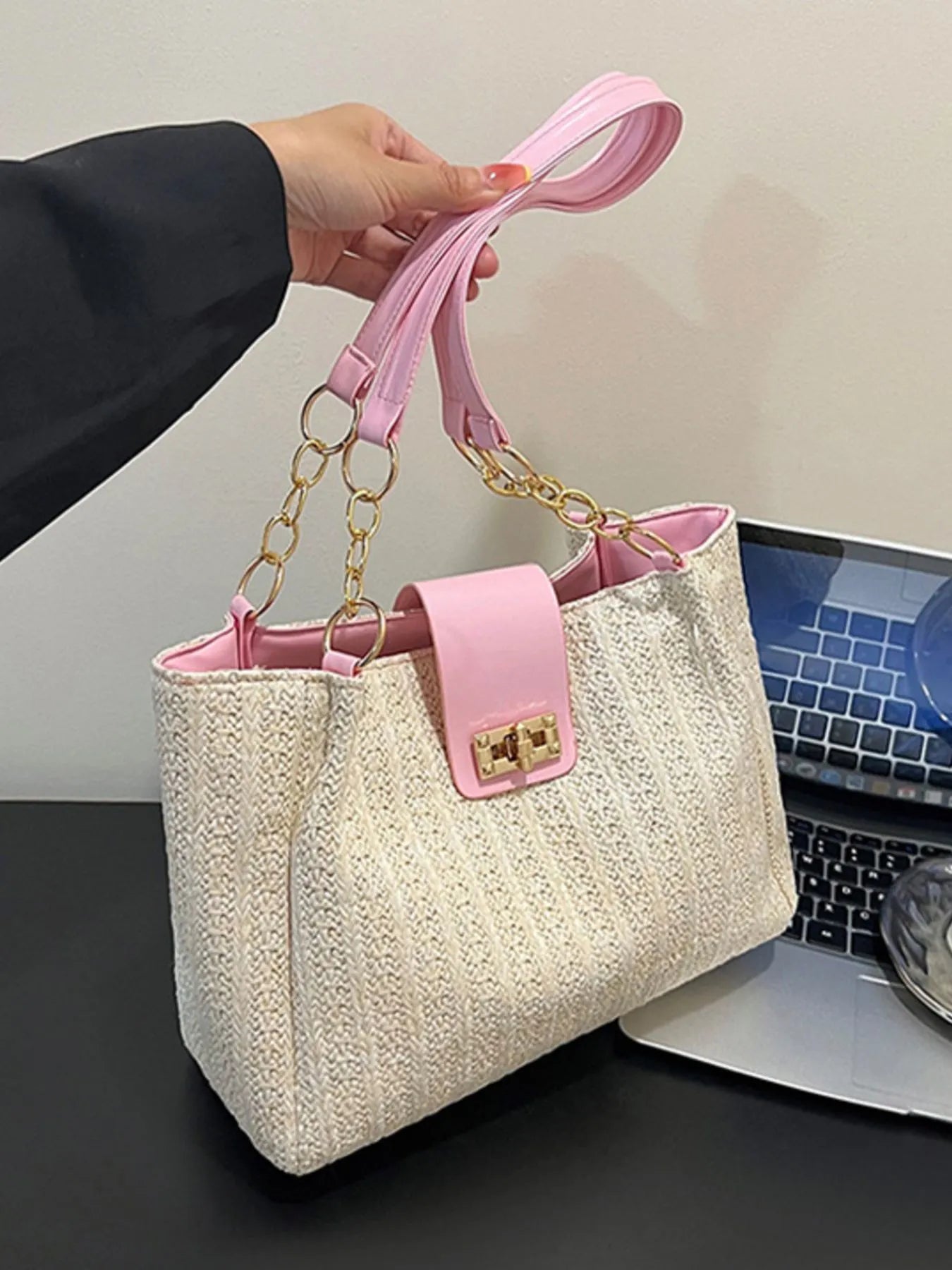 Woven straw pink shoulder bag close up
