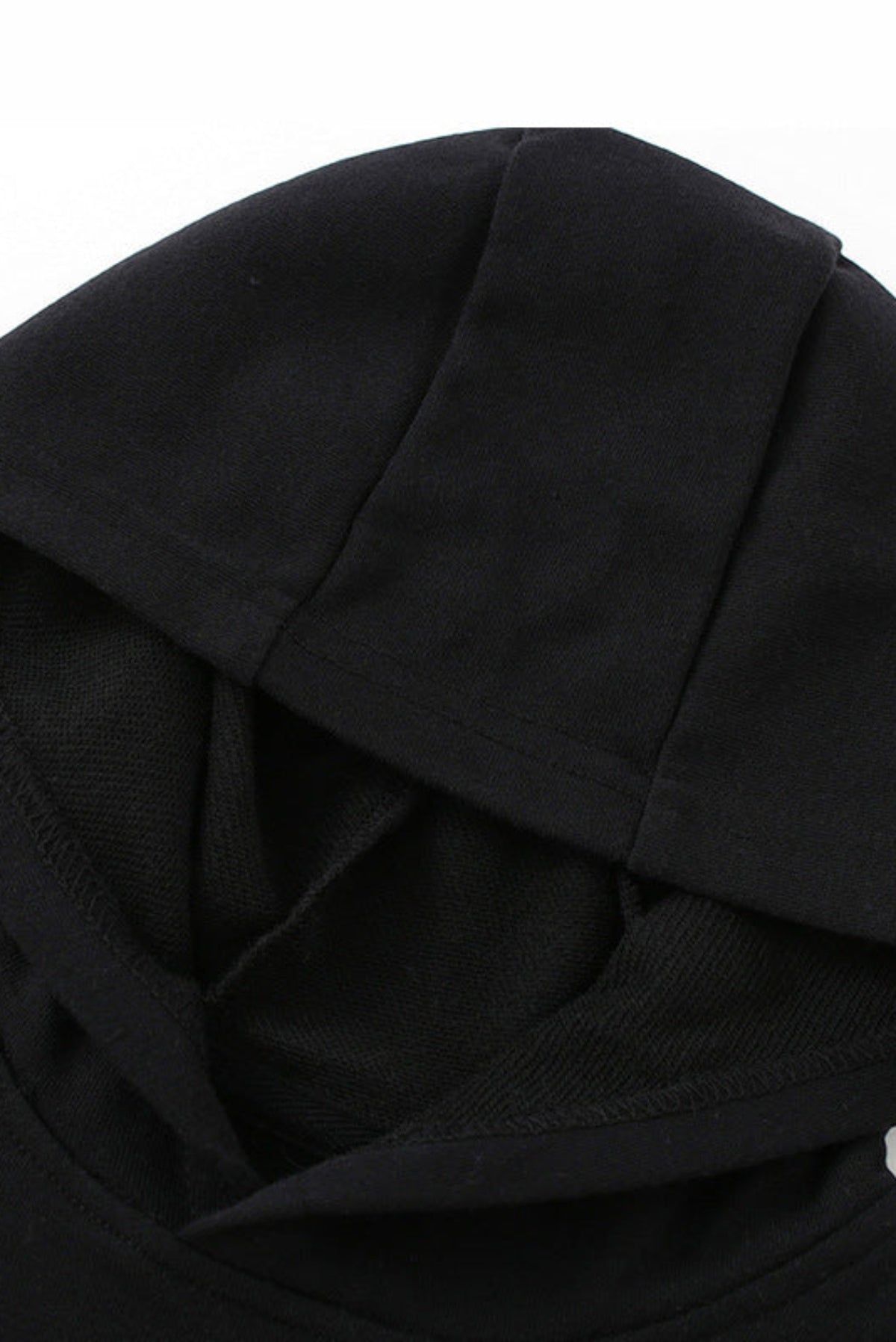Close-up of a black hooded sweatshirt showing the fabric texture and hood construction on a plain white background.