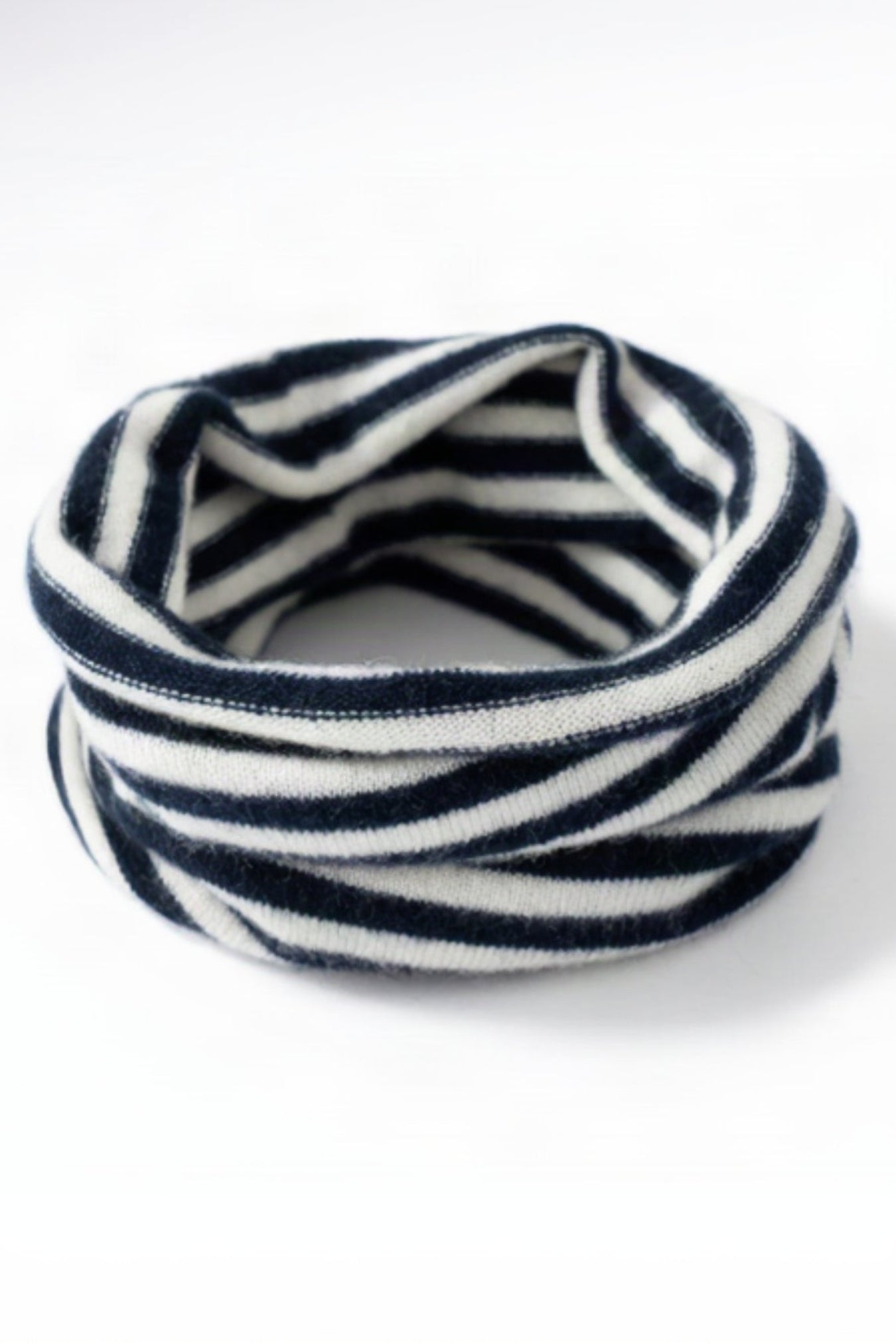 Navy and white striped headband on a white background