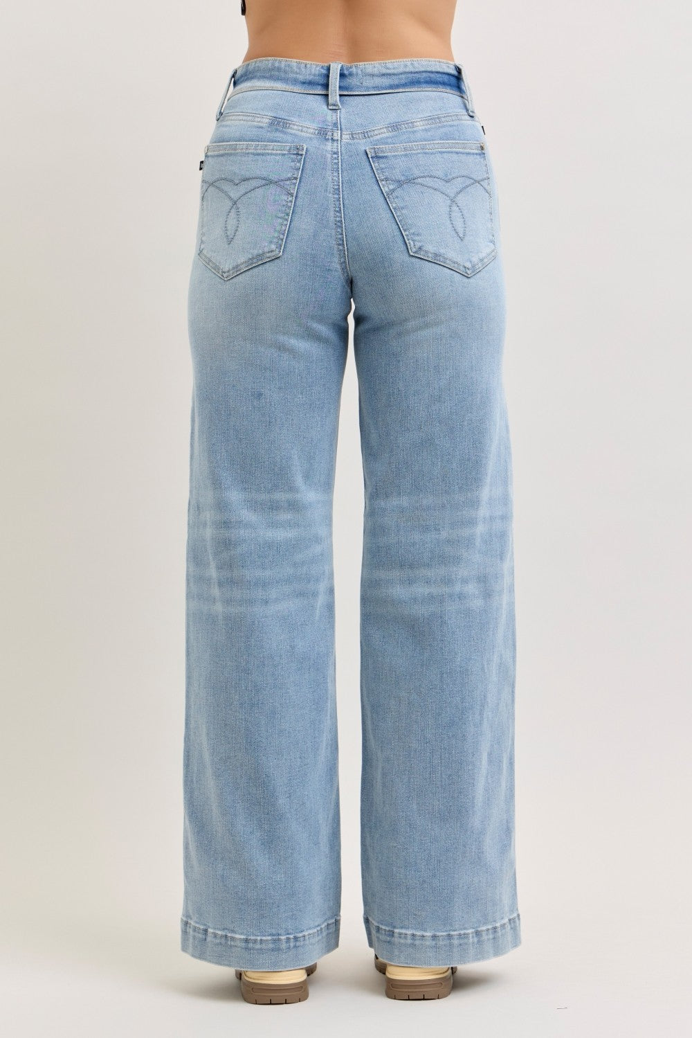Light blue jeans on a plain background