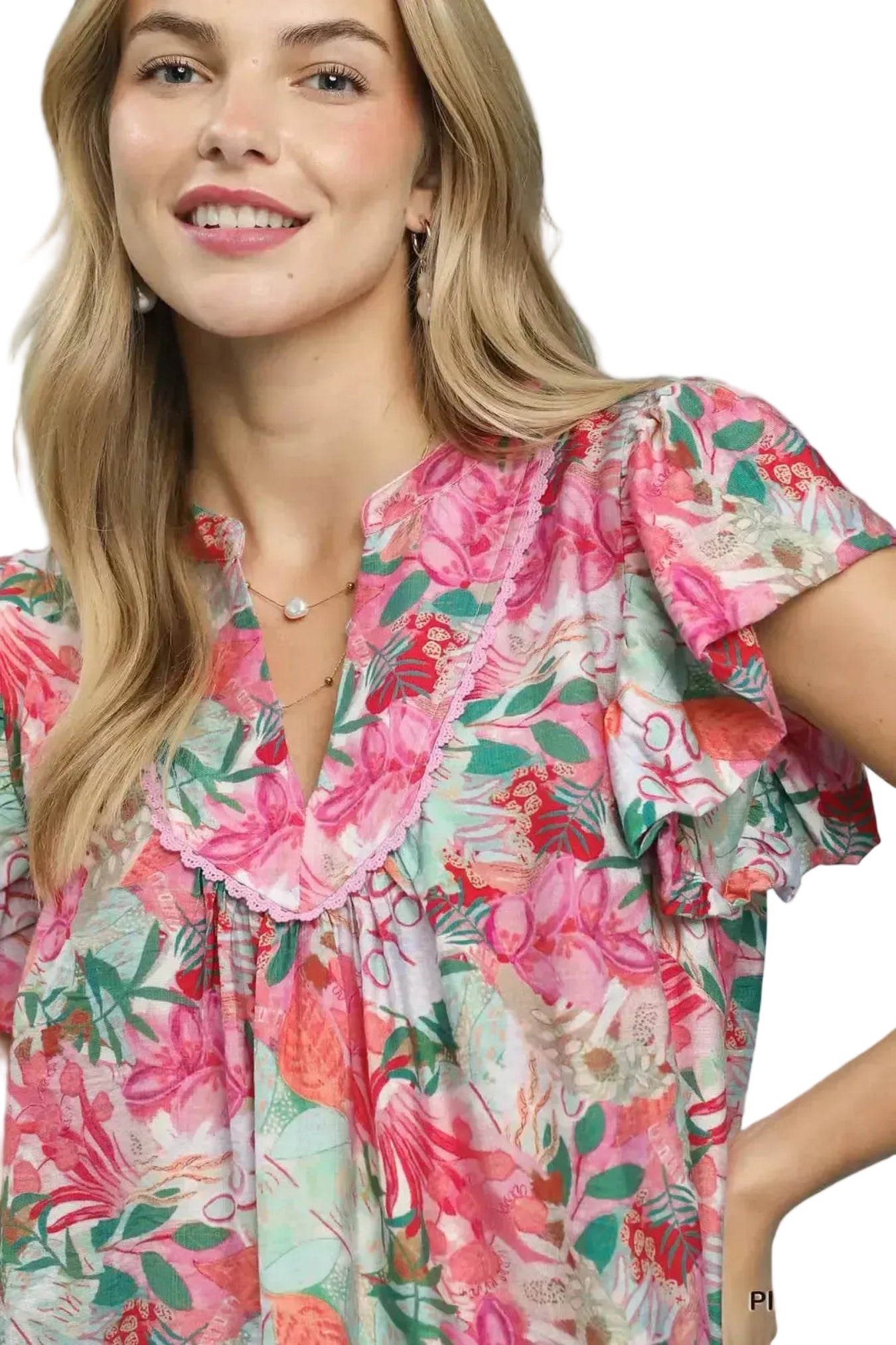 Woman wearing a colorful floral dress on a white background