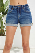 Blue denim shorts on a white background