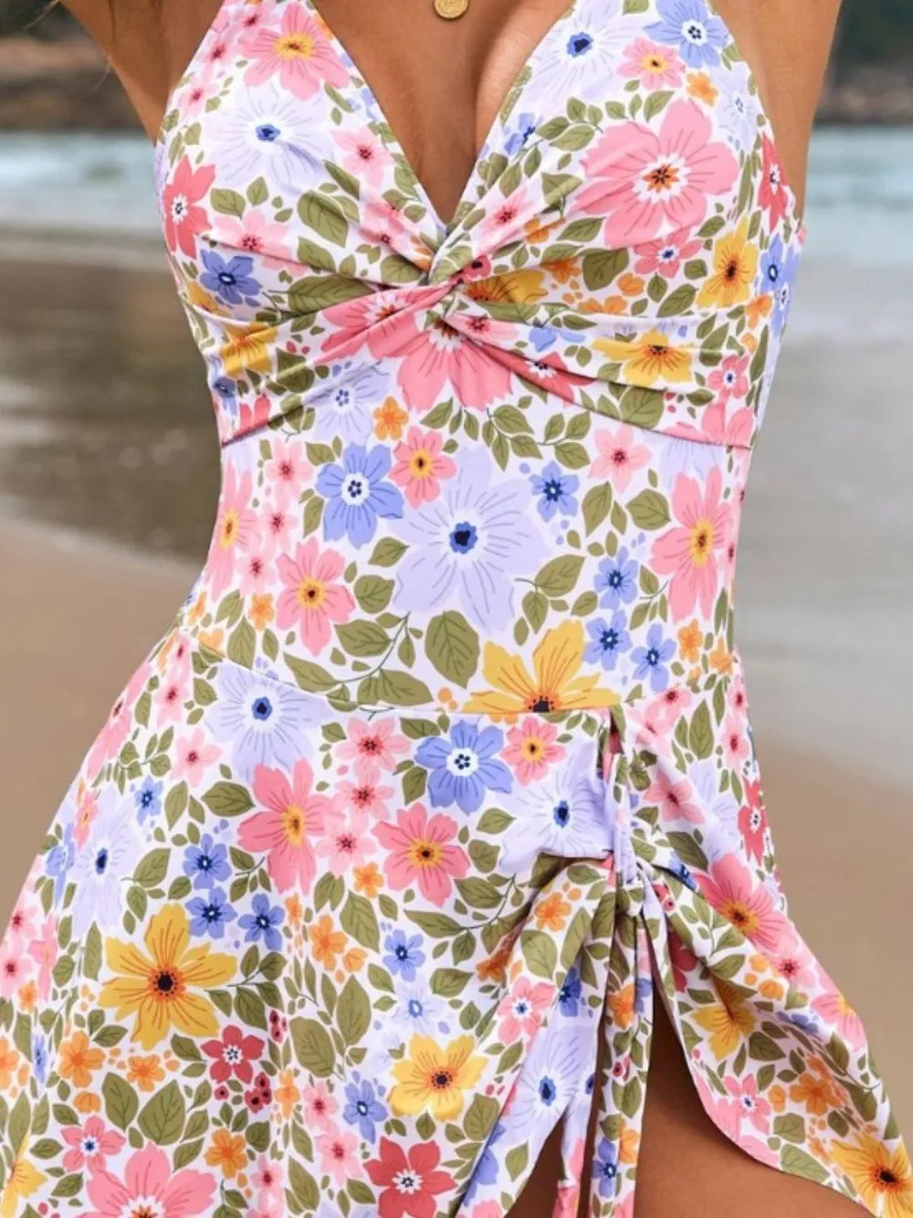 Colorful floral dress with a blurred beach background