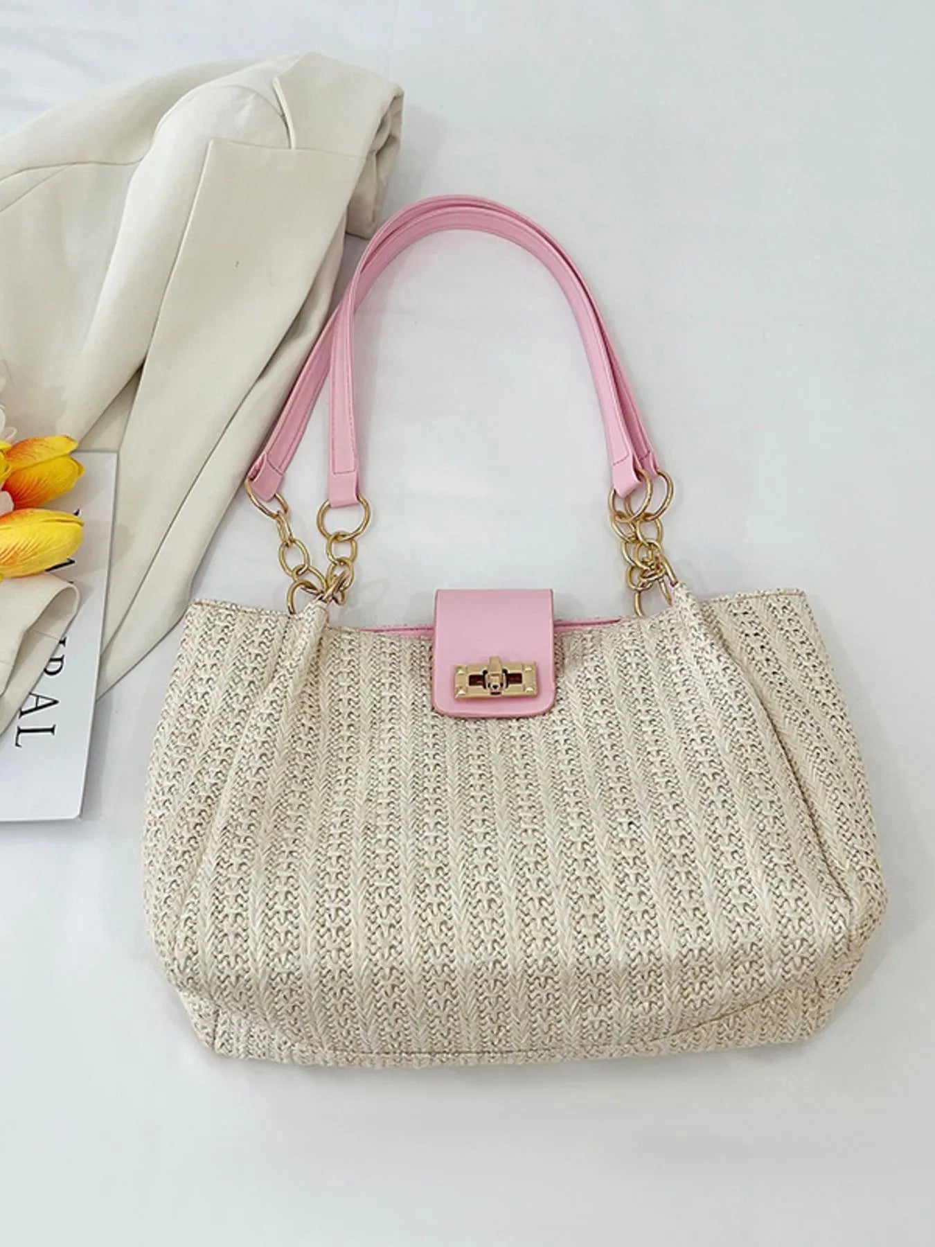 Woven straw pink shoulder bag close up