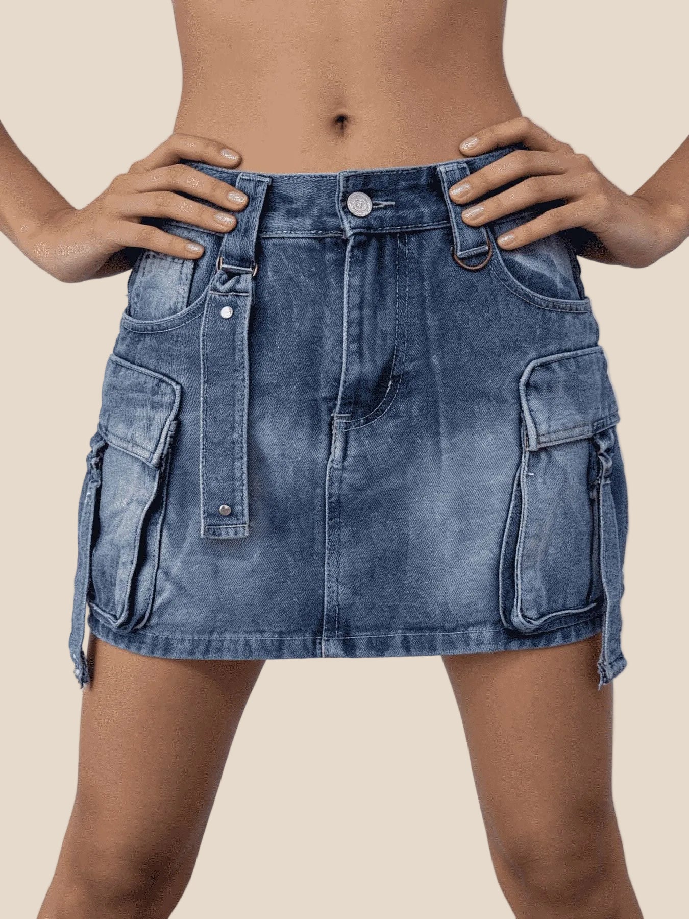 Blue denim skirt worn by a person on a white background