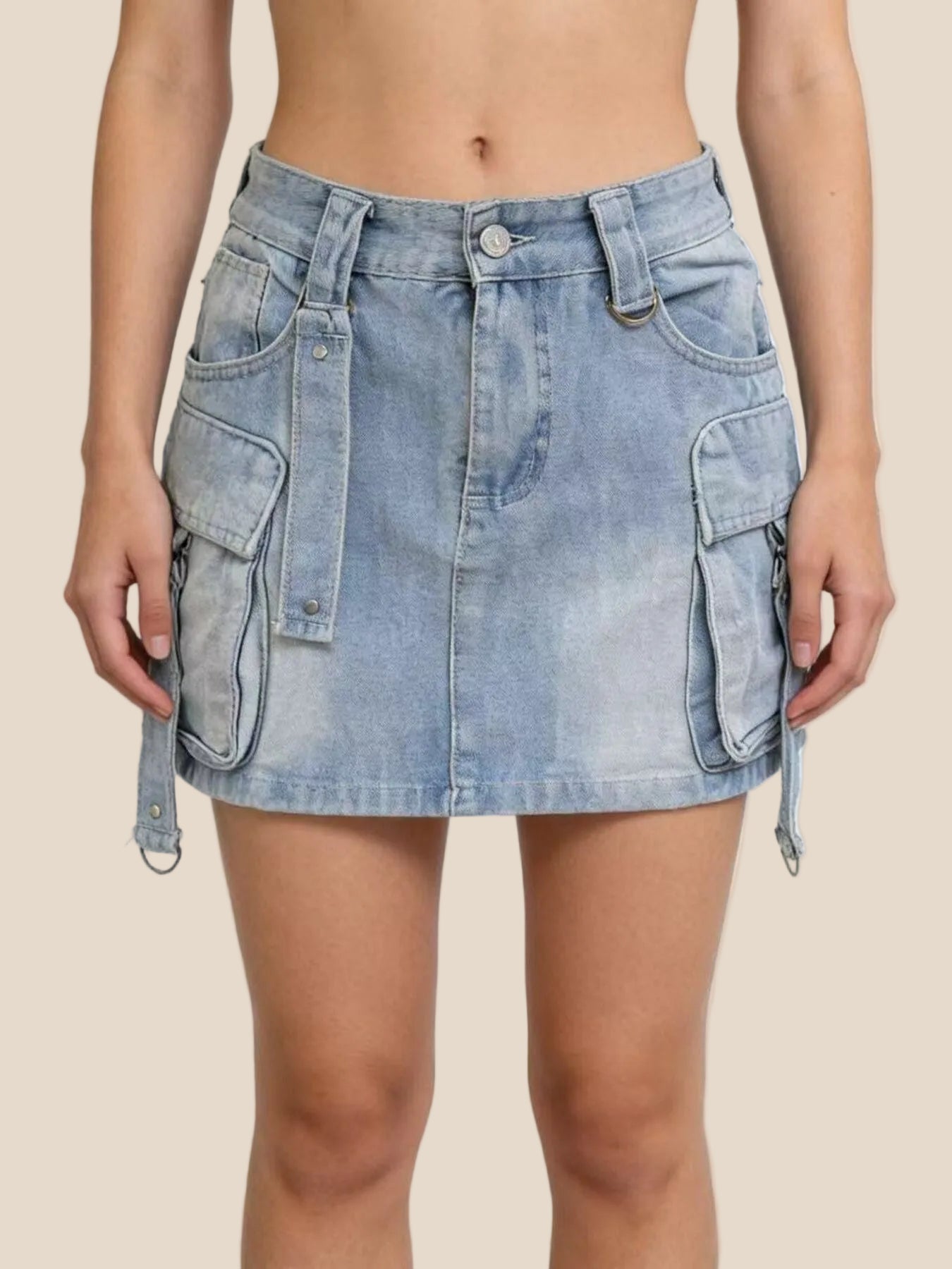 Light blue denim skirt with multiple pockets on a white background