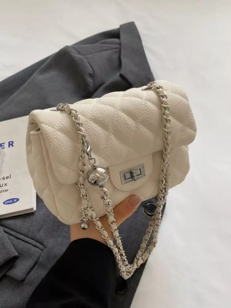 White quilted crossbody bag front view – gold chain strap