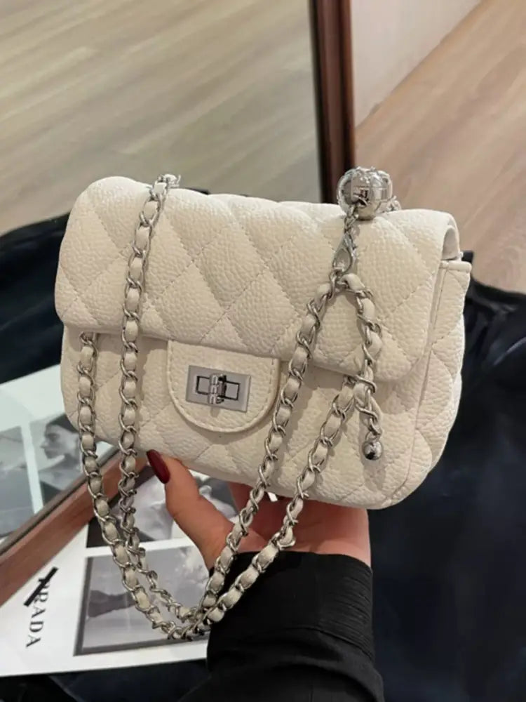 White quilted crossbody bag front view – gold chain strap