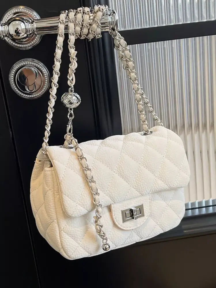 White quilted crossbody bag front view – gold chain strap