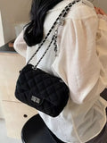Black quilted crossbody bag front view – gold chain strap